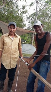 Lifeword Community Radio trainee Bro. Baldemar watches, helps and learns from Bro. Luis Gonzalez on the La Concepcion installation in March.